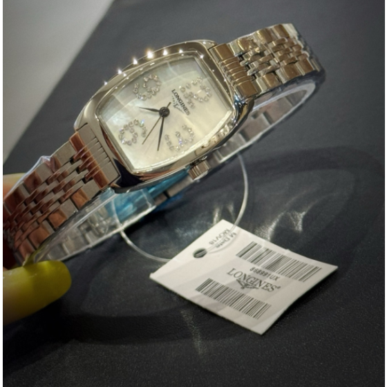 The Longines Heritage Collection L2.155.4.71.5 features a classic tonneau-shaped stainless steel case.